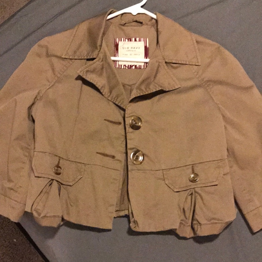 Women’s light brown suit jacket.